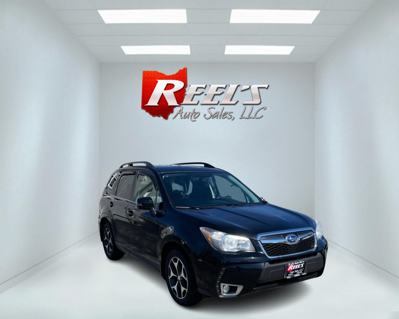 2014 Black /Black Subaru Forester 2.0XT Touring (JF2SJGMC4EH) with an 2.0L H4 SOHC 16V TURBO engine, Automatic transmission, located at 547 E. Main St., Orwell, OH, 44076, (440) 437-5893, 41.535435, -80.847855 - This 2014 Subaru Forester 2.0XT Touring is a well-equipped compact SUV featuring a powerful 2.0L turbocharged engine matched with a continuously variable transmission (CVT) for a blend of performance and efficiency. It boasts a range of high-end amenities, including heated seats, X-Mode for enhanced - Photo#2